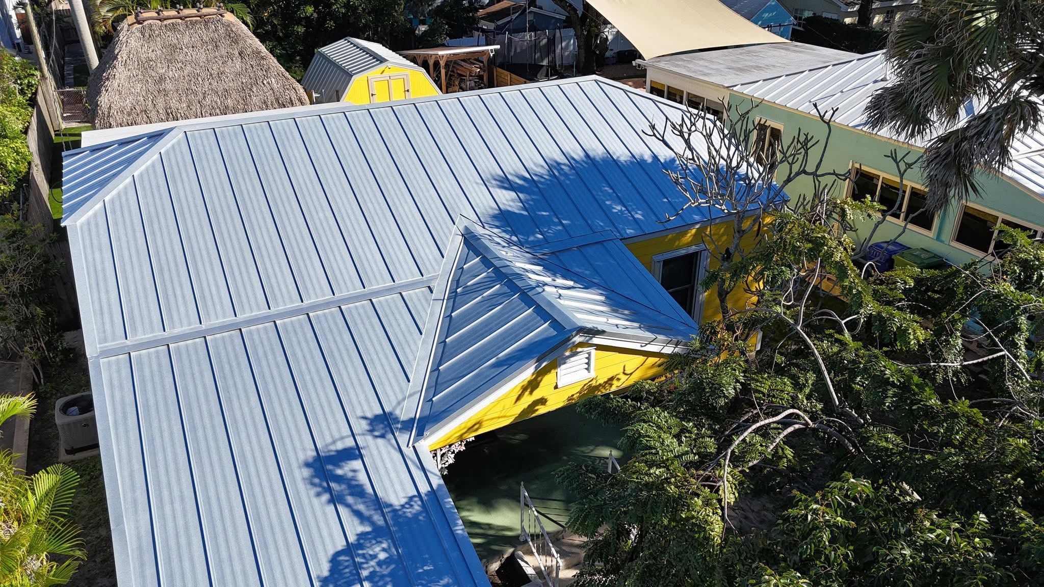 Experienced Austin TX roofing contractor Cuatro Pilares installing standing seam metal roof for long-lasting residential protection