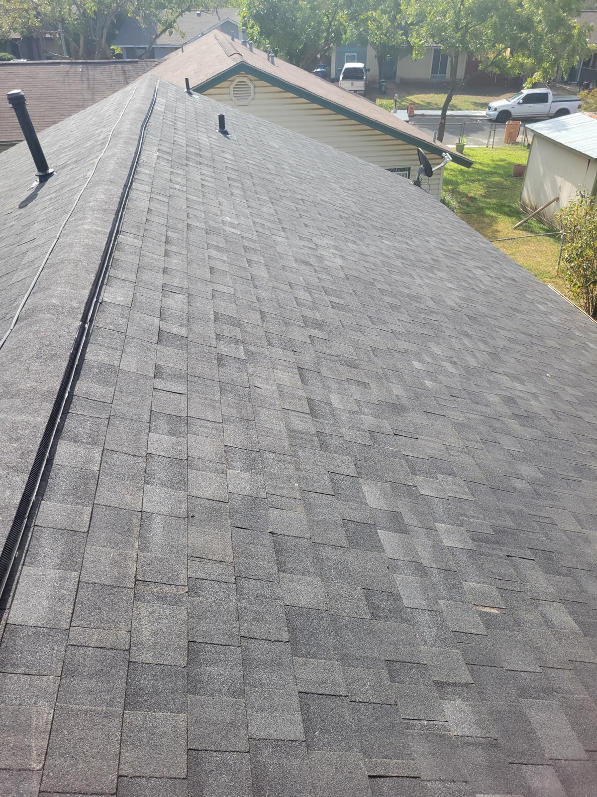Experienced Austin TX roofing contractor Cuatro Pilares completing residential roof replacement with architectural shingles for long-lasting protection