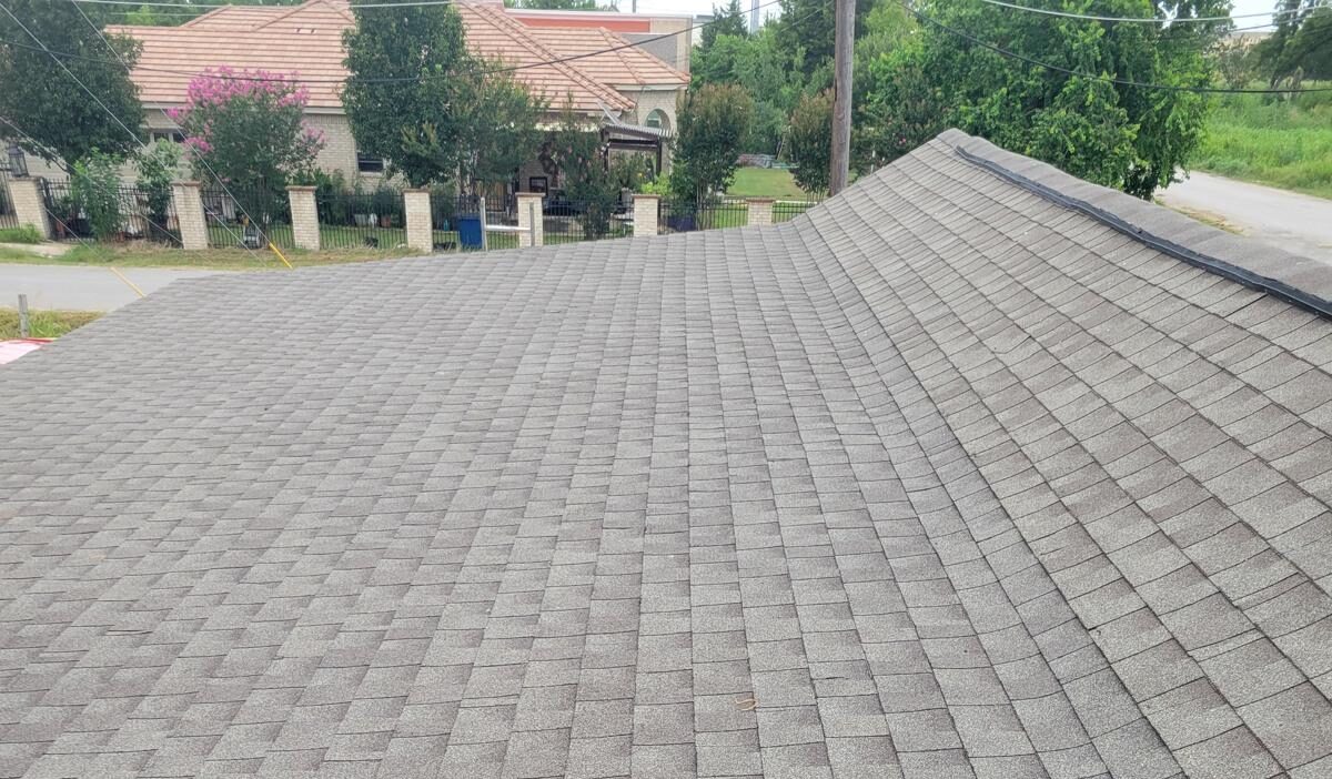 Asphalt Shingle Roof Inspection and Replacement in Texas Residential asphalt shingle roof inspection in Texas showing weathered shingles and typical wear condition